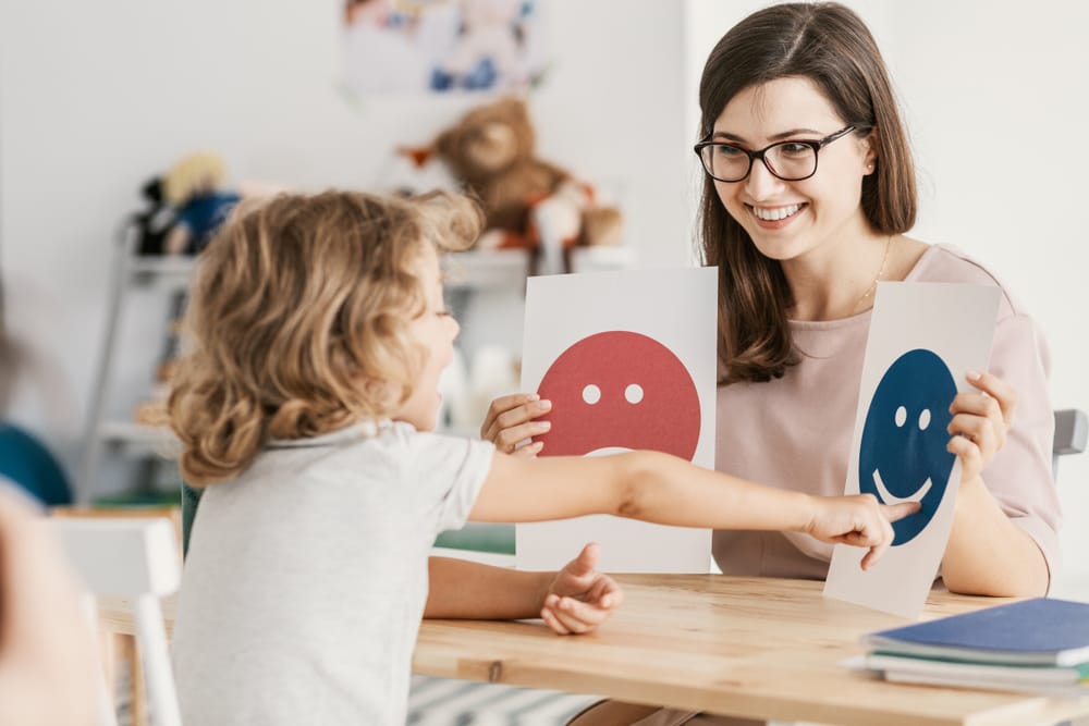 woman teaching kid - Eye Specialist Reno NV